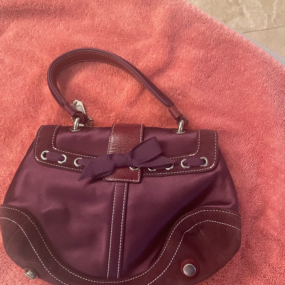 Coach mini purple bag.